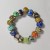 Ręcznie wykonana bransoletka ze szkła artystycznego (szkło sodowo-wapniowe) lampwork leży płasko