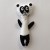 Ręcznie robiony magnes na lodówkę  z filcu Panda czarno biała podniesione ręce