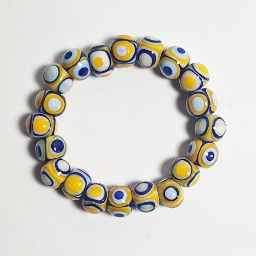Słoneczne Oko  ręcznie wykonana bransoletka  ze szkła artystycznego  lampwork widok z góry