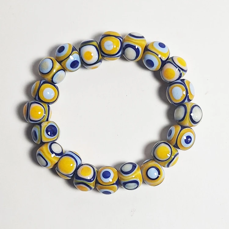 Słoneczne Oko  ręcznie wykonana bransoletka  ze szkła artystycznego  lampwork widok z góry