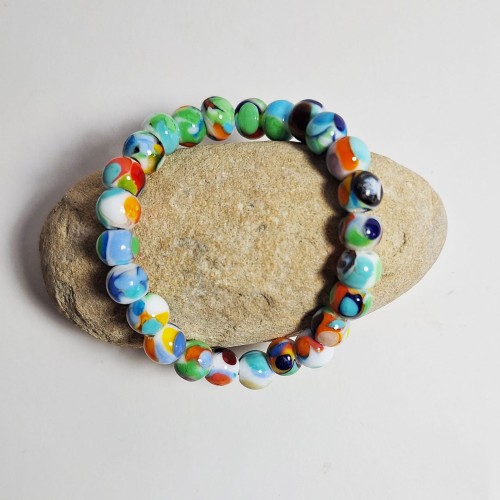 Ocean Kolorów  ręcznie wykonana bransoletka  ze szkła artystycznego  lampwork płasko prezentowana na kamieniu